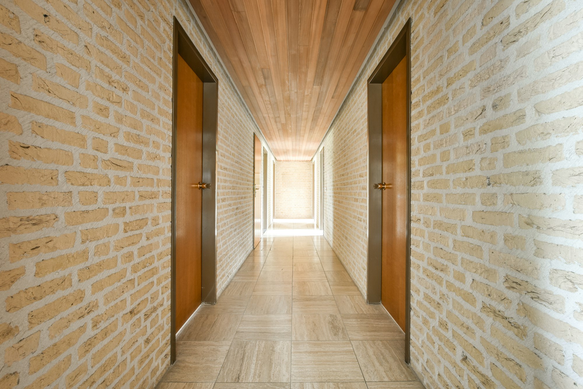 Narrow corridor with doors